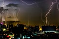 Dramatic thunder storm lightning bolt on the horizontal sky and city scape