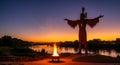 Majestic statue fire and sunset over the river Royalty Free Stock Photo