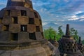 Dramatic view of ancient stupa borobudur temple with Mount Merapi in background. the world`s largest Buddhist temple and UNESCO