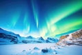 dramatic view of a bright aurora above glacier-covered mountains Royalty Free Stock Photo