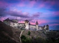 Dramatic sunset view on the castle in Kamianets-Podilskyi in spring. Royalty Free Stock Photo