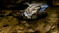 Deep Cave Chamber with Jagged Rock Formations and Natural Light Royalty Free Stock Photo