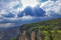 Dramatic view of cliffs with rainforest, sunrays falling through storm clouds, Chapada dos Guimaraes, Mato Grosso, Brazil, South Royalty Free Stock Photo