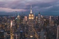Dramatic View of Dark Manhattan, New York City, Empire State Building and Skyline right after Sunset with City Lights in Royalty Free Stock Photo