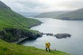 Dramatic view of green hills of Vagar island and Sorvagur town