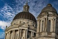 Dramatic view of historic domed buildings against a cloudy blue sky in Liverpool, UK Royalty Free Stock Photo