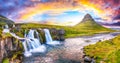 Dramatic view on Kirkjufellsfoss waterfall near Kirkjufell mountain at sunset