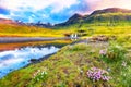 Dramatic view on Kirkjufellsfoss waterfall  near Kirkjufell mountain at sunset Royalty Free Stock Photo