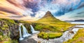 Dramatic view on Kirkjufellsfoss waterfall  near Kirkjufell mountain at sunset Royalty Free Stock Photo