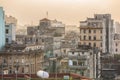 Dramatic view of old, retro antique Havana Cuban town, staying in dusty smog environment and overcast sky with people in