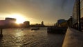 dramatic sunset rays shining over London urban skyline silhouette and the thames river Royalty Free Stock Photo