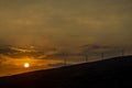 Dramatic view of windmills at sunset in Hawaii