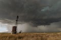 A severe thunderstorm with a windmill in the foreground Royalty Free Stock Photo
