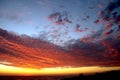 Dramatic Volcanic Crimson Sunset over Pacific Ocean Royalty Free Stock Photo