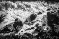 Dramatic waves crashing on rocky shore