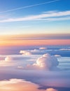 Dramatic white clouds and blue sky from airplane window view Colorful sunset cloudscape background. Royalty Free Stock Photo