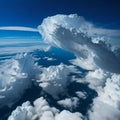 Dramatic white clouds and blue sky from airplane window view Colorful sunset cloudscape background. Royalty Free Stock Photo