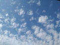 Dramatic White Clouds in a Blue Sky Background. Heavenly feeling white Cloud in a summer season at mid day Royalty Free Stock Photo