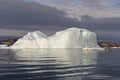 Dramatic White Iceberg against Gray Clouds