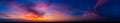 Dramatic wide panorama of late sunset with burning sky Royalty Free Stock Photo