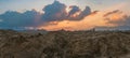 Dramatic wide Sunset panorama over Red Sea Hills mountain chain and Sahara desert. Sun already behind horizon line, wide photo. Royalty Free Stock Photo