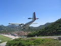 Dramatic Winair plane landing at St Barts airport Royalty Free Stock Photo