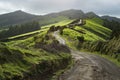 Dramatic winding road path trail in mountains meadows grass fields landscape, New Zealand Royalty Free Stock Photo