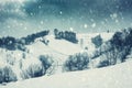 Dramatic winter landscape, mountain slope during blizzard