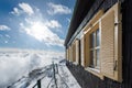 Dramatic wintry scene with snowy house.