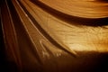 Dramatically draped gold fabric background Royalty Free Stock Photo