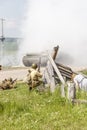 dramatization. soldier of great patriotic war holding a rifle. a lot of smoke. there are civilians