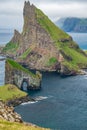 Drangarnir gate in front of Tindholmur wall, Faroe Islands