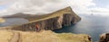 Drangarnir Sea Stack Peaks rising out of the atlantic ocean on the Faroe Islands.