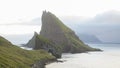 Drangarnir Sea Stack Peaks rising out of the atlantic ocean on the Faroe Islands.