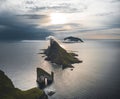 Drangarnir and Tindholmur on Faroe Islands Vagar, aerial drone view during sunset in North Atlantic Ocean. Faroe Islands