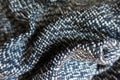 Draped blue, black and white tweed