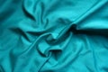 Draped blue green fabric from above