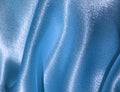 Draped blue satin background