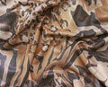 Draped brown multicolored fabric with spangles