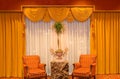 Draped curtains and chairs