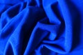 Draped electric blue smooth cloth