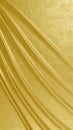 Draped gold foil fabric with soft folds and reflective metallic textile texture Royalty Free Stock Photo
