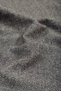 Draped herringbone tweed wool fabric texture