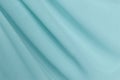 Draped light-blue polyester fabric background
