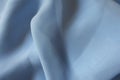 Draped lightweight sky blue polyester chiffon cloth Royalty Free Stock Photo