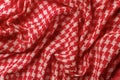 Draped shemagh of red white colors background. Arab desert scarf hirbawi texture. Folded cotton keffiyeh macro. Full frame kefia