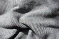 Draped heather grey rib knit fabric Royalty Free Stock Photo