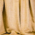 Drapes of golden damask material Royalty Free Stock Photo