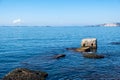 Drapetsona old harbor, Piraeus, Greece. Old structure of stone mooring bollards in the sea