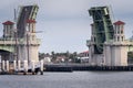 Draw bridge opening to let a sail boat through